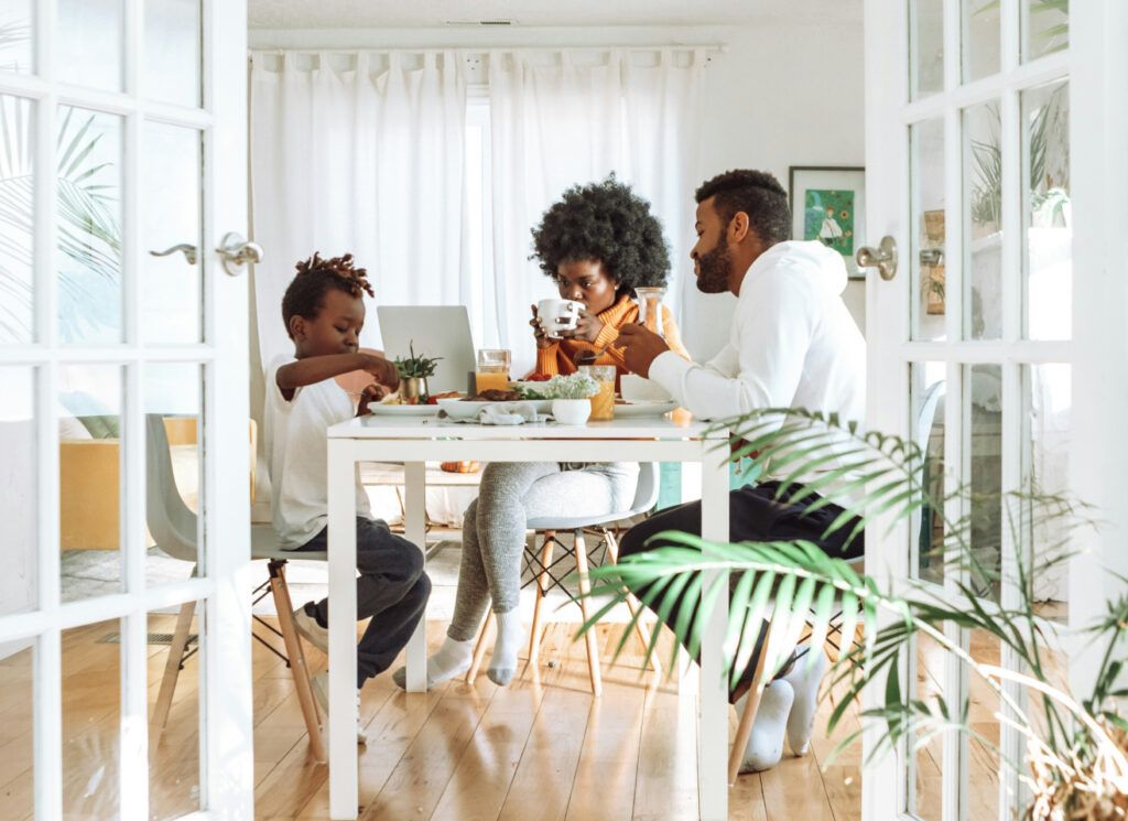 A family in a sunlit dining area
