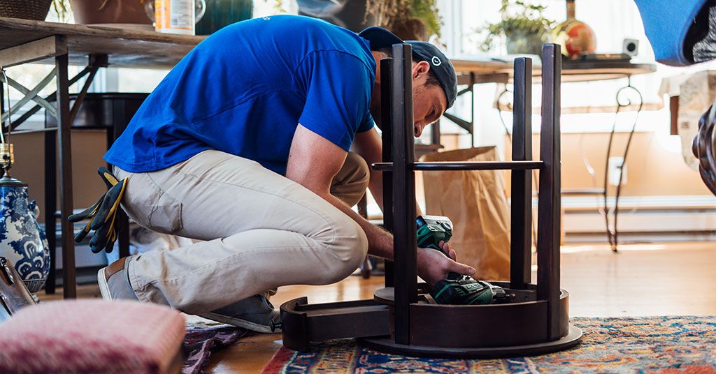 man fixing table
